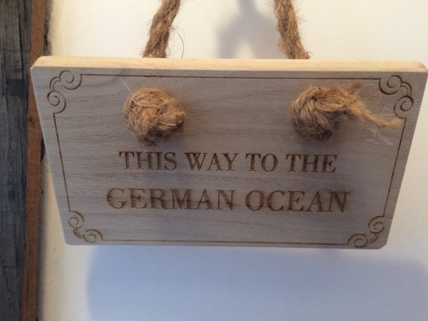 Staithes folk call the North Sea 'the German Ocean'. Sign made by author for a Staithes property. Copyright John Keeling